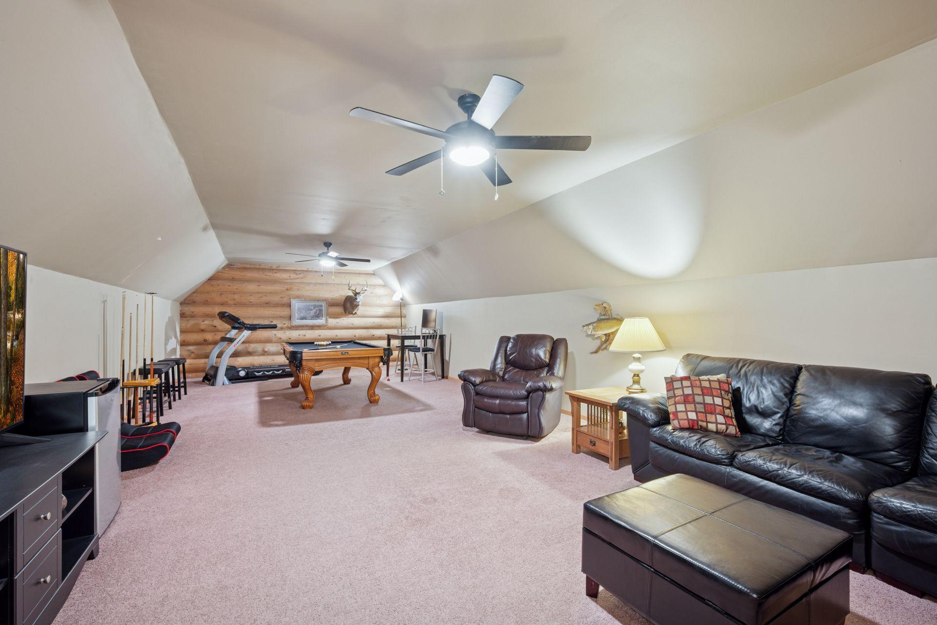 The huge bonus room is a great space for everyone to hang out.