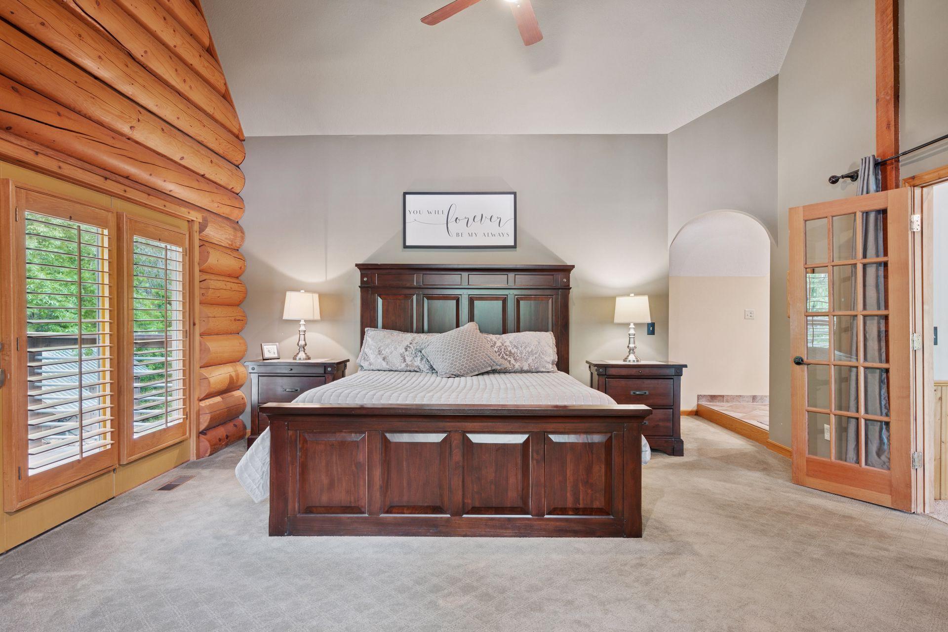 The upper-level primary bedroom walks out to the private Juliet balcony.