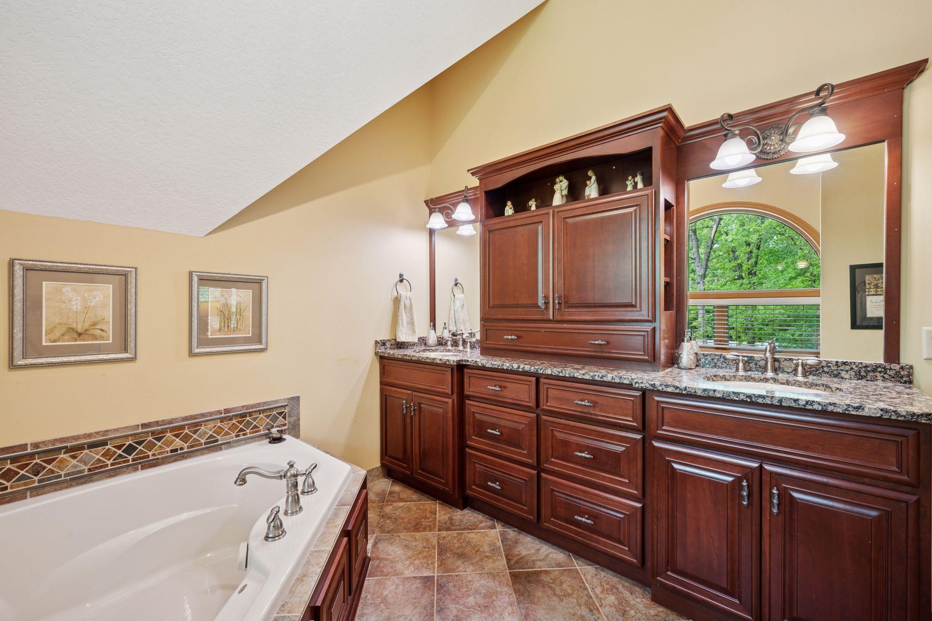 Double vanities and ample storage along with heated floor.