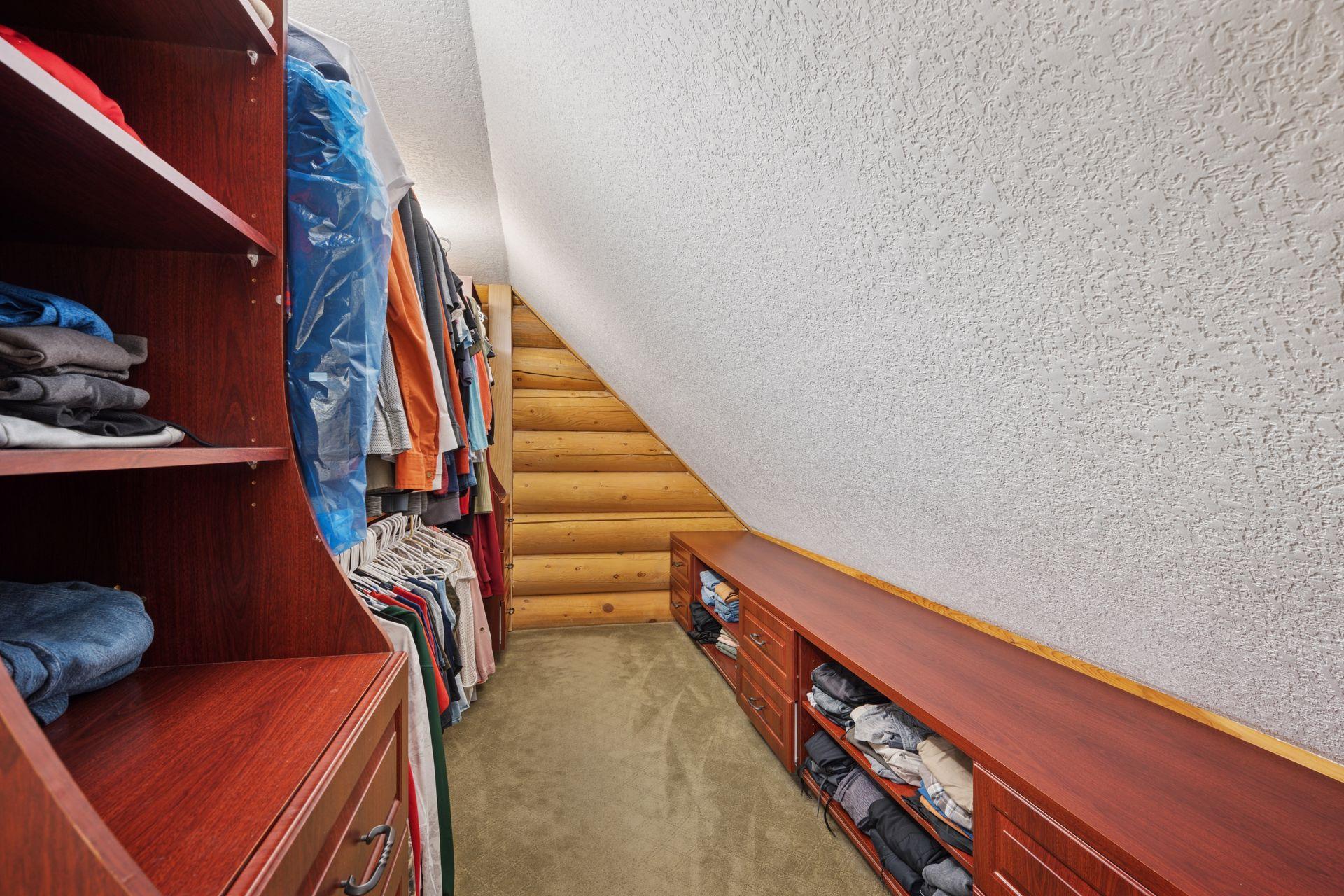Primary walk-in closet with built-ins