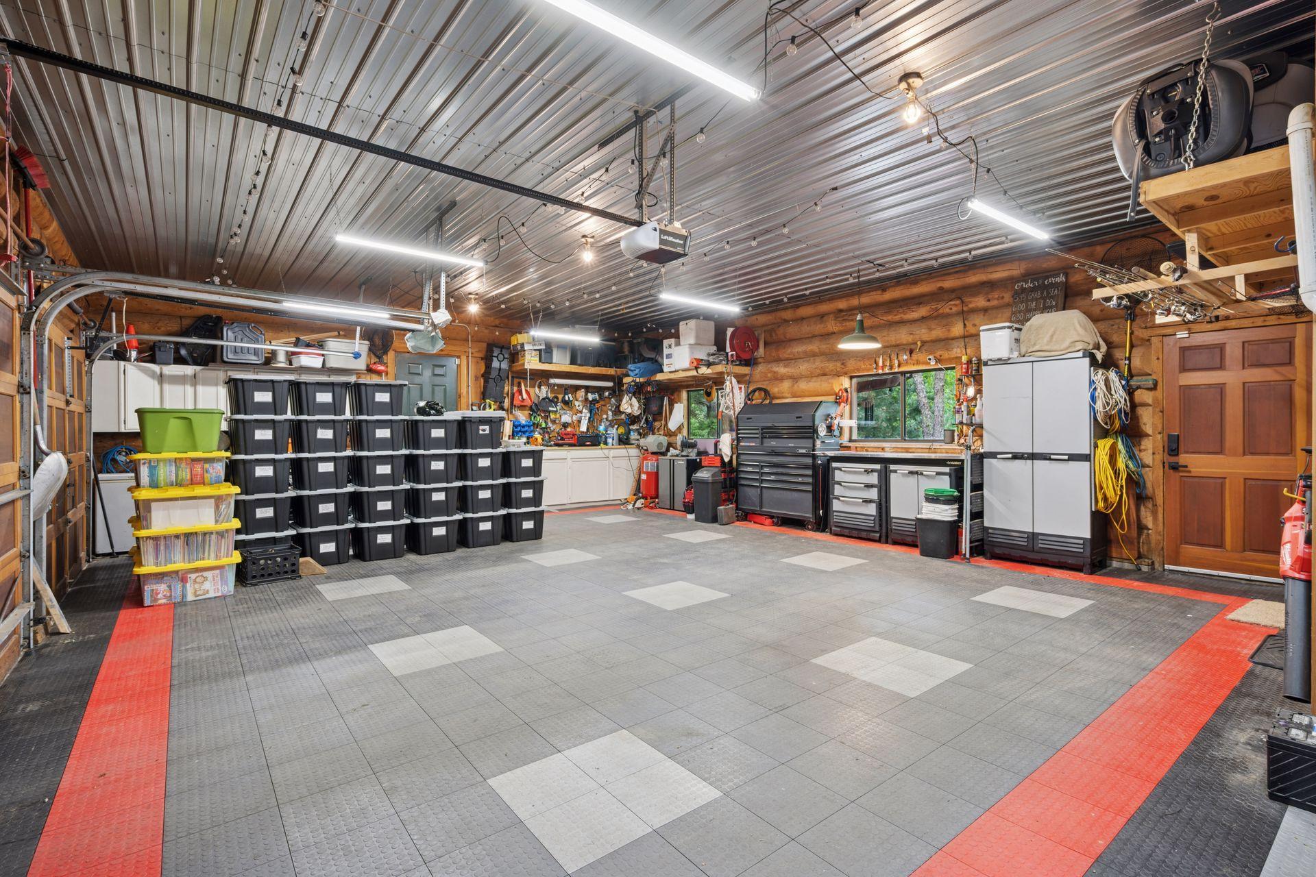 The amazing garage is heated with built-in cabinets and half bath