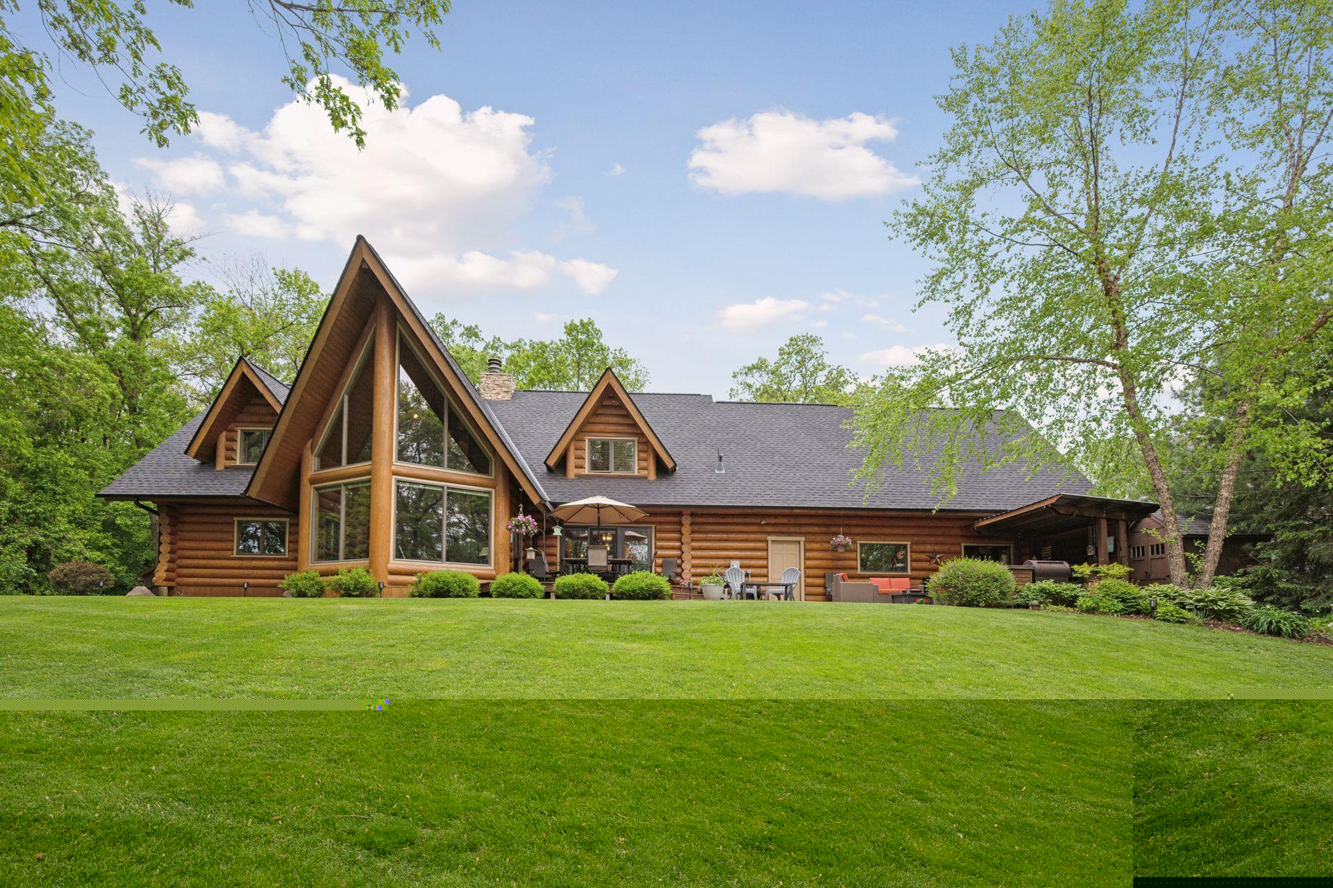 Rear view of the home. Those massive windows look out to the river.