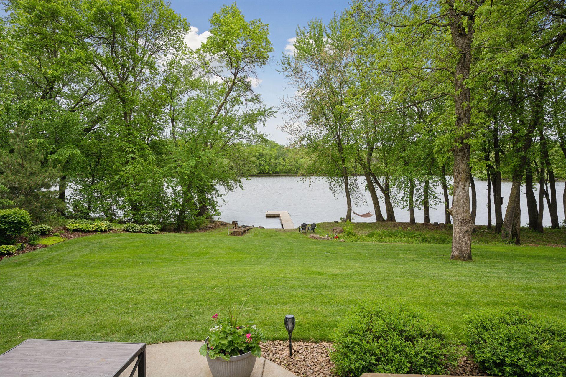 This stunning Mississippi river property offers a level lot that stretches effortlessly to the water's edge!