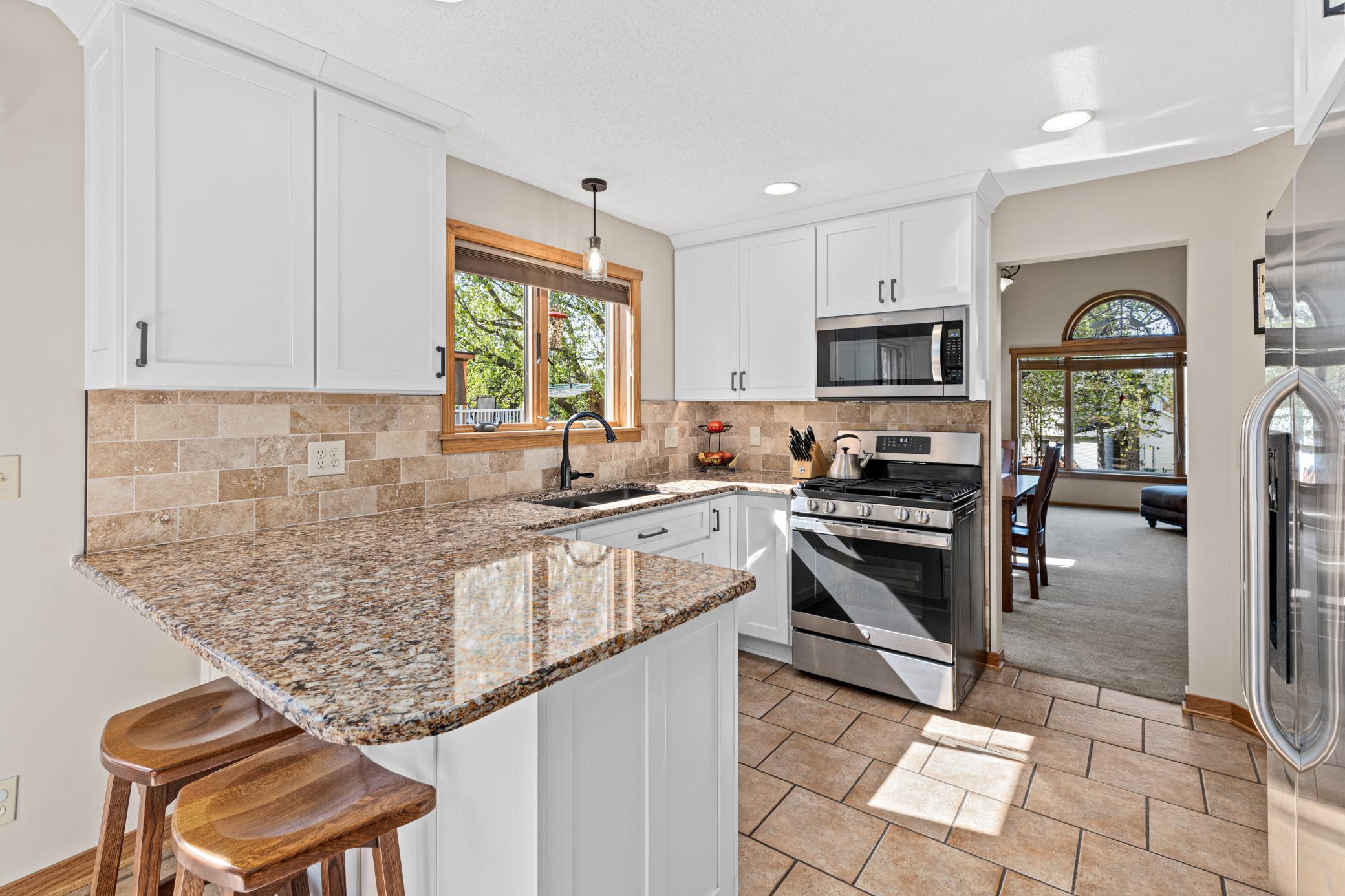 Beautifully remodeled kitchen with custom cabinetry and timeless finishes