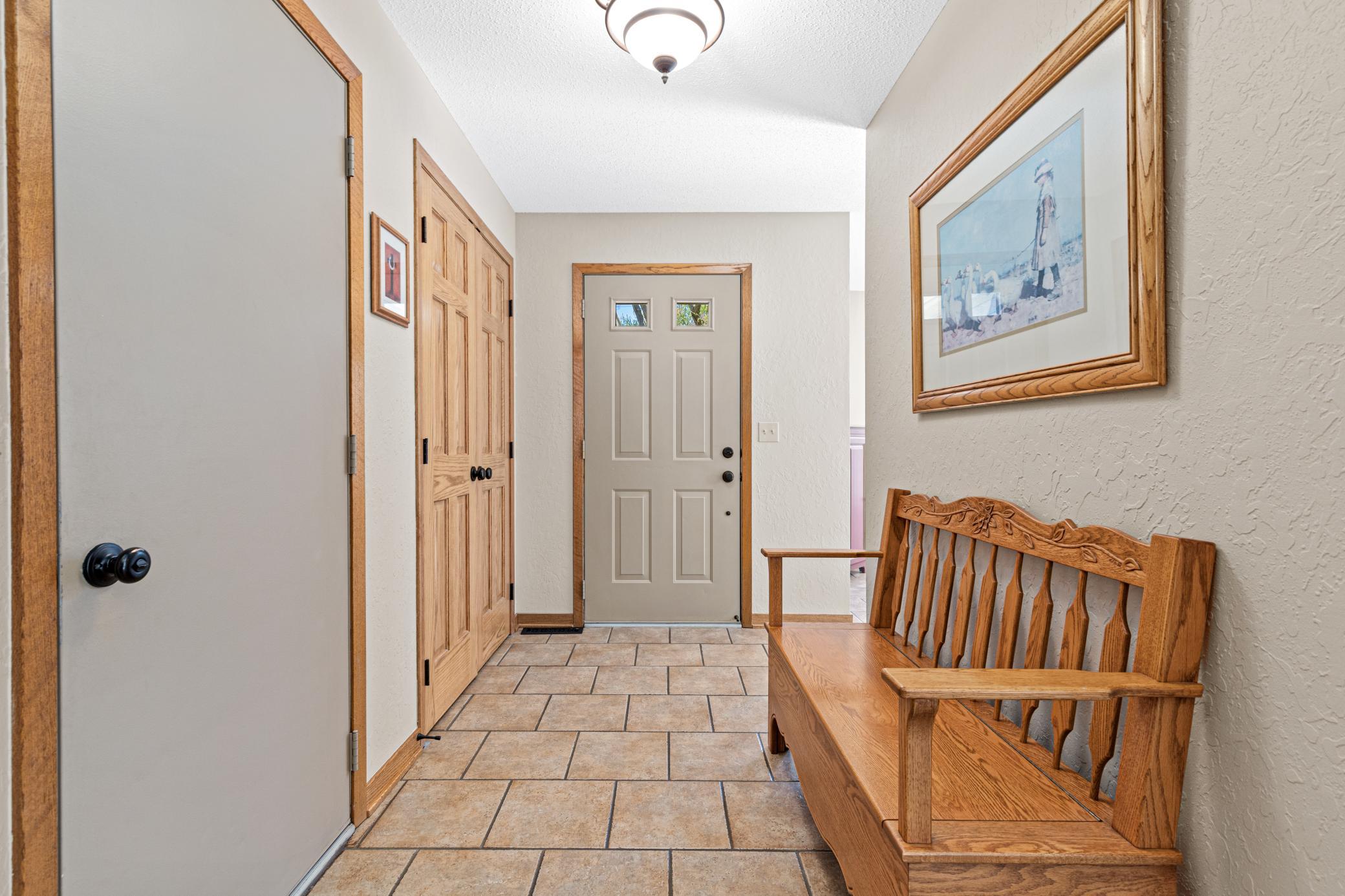 Step inside to a bright, welcoming foyer that sets the tone for the home