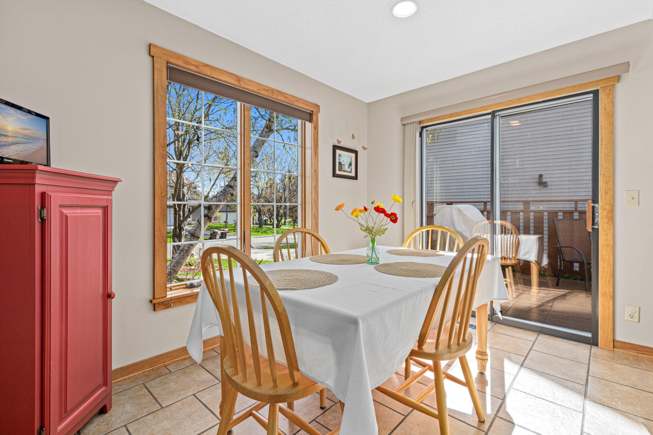 Informal dining nook filled with natural light and deck access