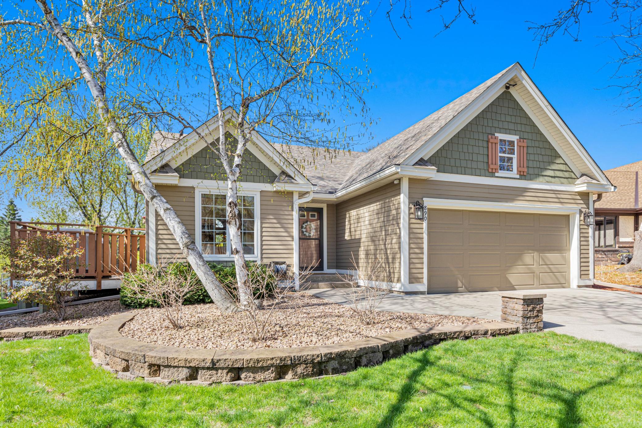 Mature trees and thoughtful landscaping create a warm, storybook setting from the start