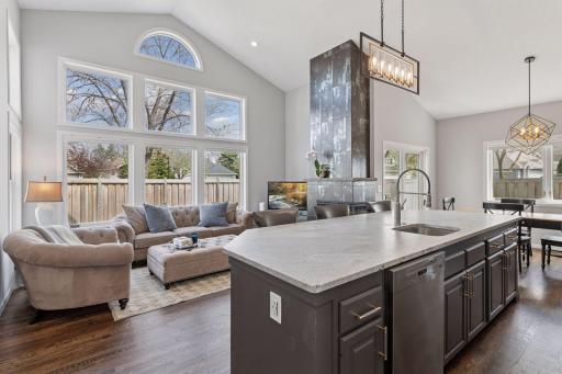Recently updated main living areas are enhanced by the vaulted ceiling, expansive windows, and hardwood floors