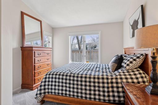 The second bedroom on the main level also features new carpet and paint