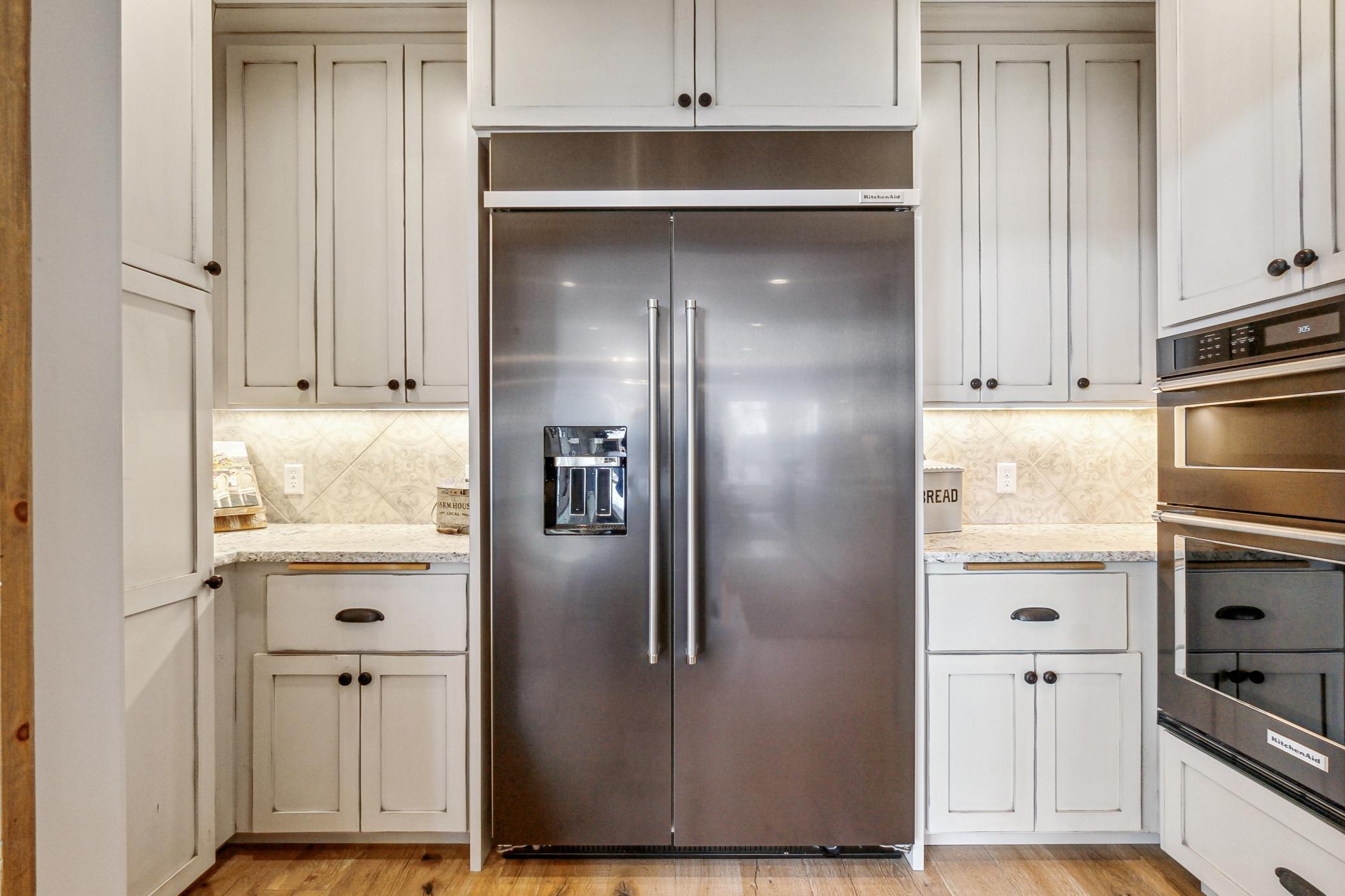 Stainless steel appliances and loads of custom cabinetry.