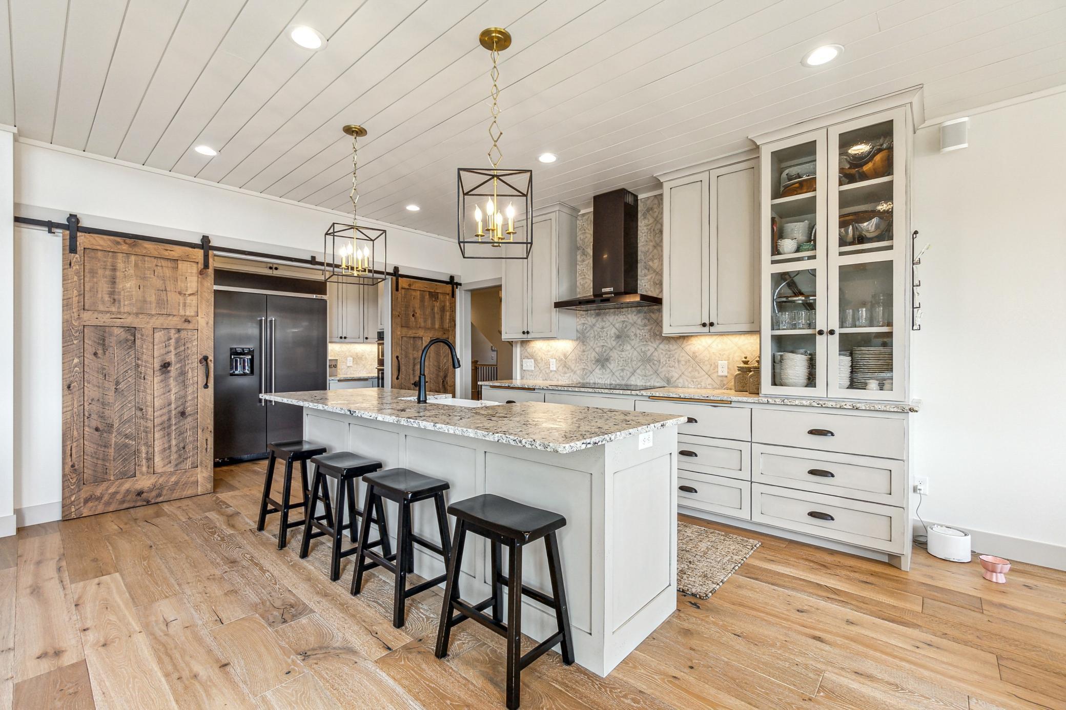 Large center island and beautiful hardwood floors throughout the main level.