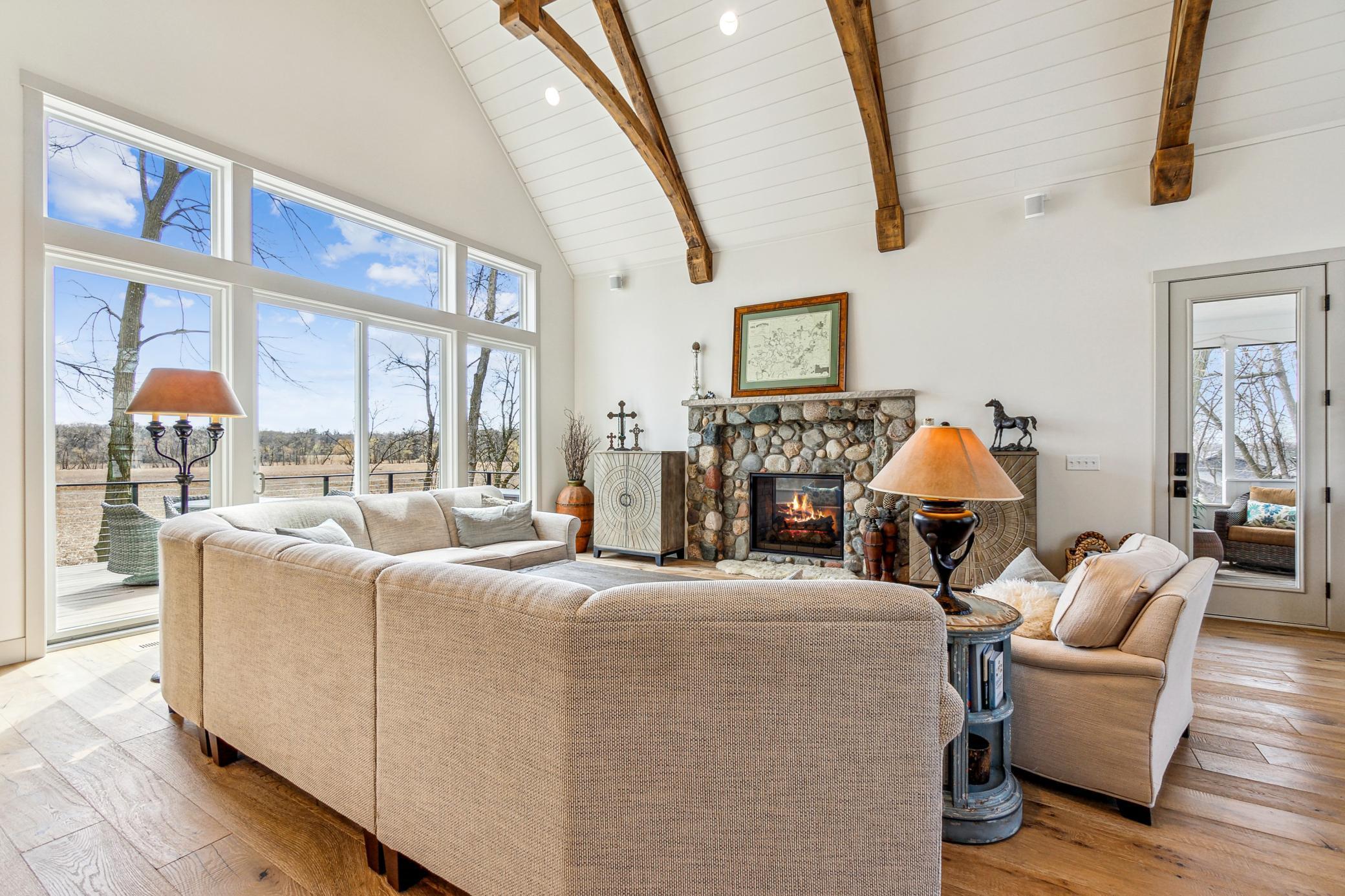 Living room has walls of glass overlooking private oasis.