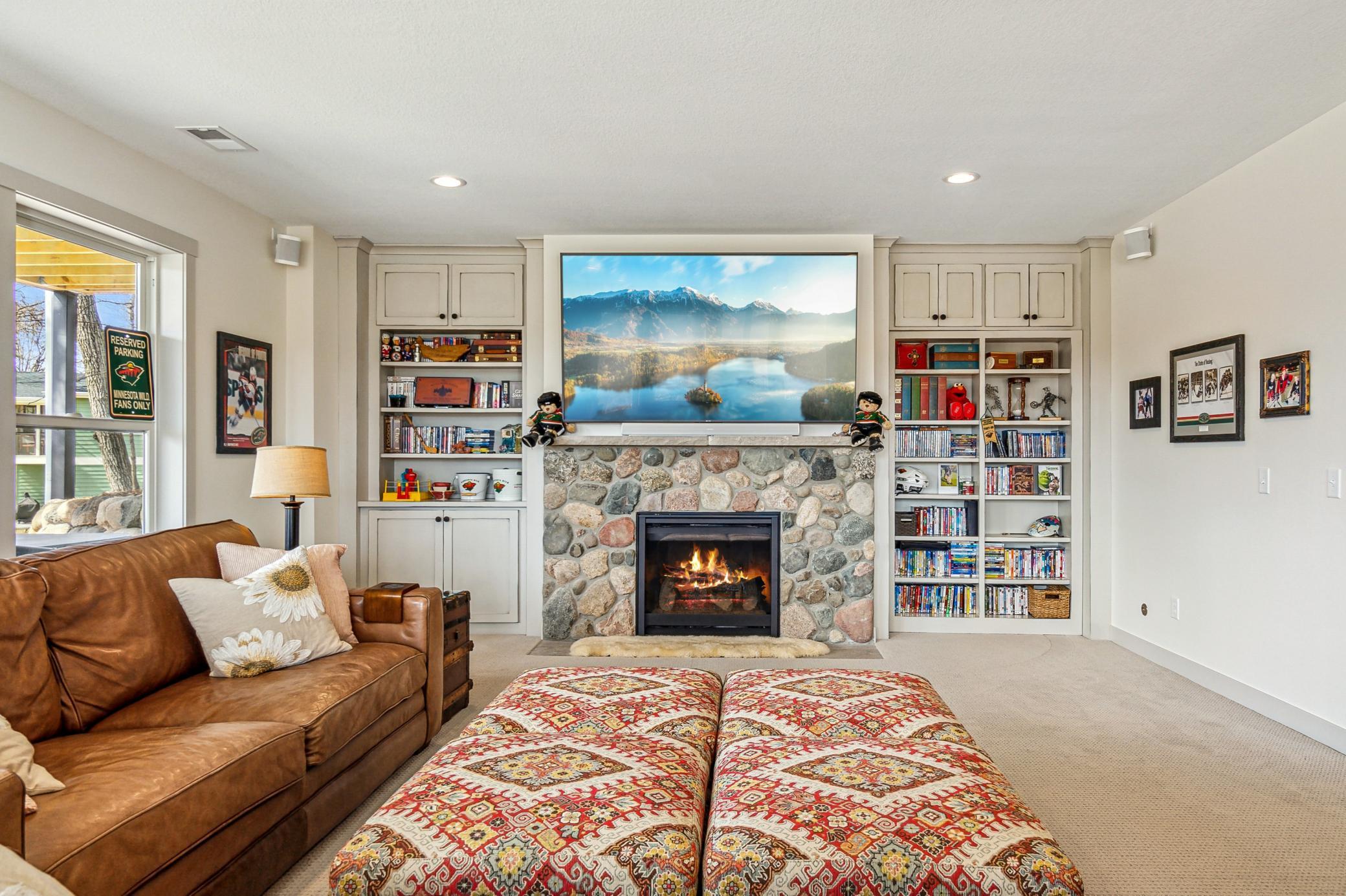 Family room with beautiful built-ins and cozy gas fireplace.