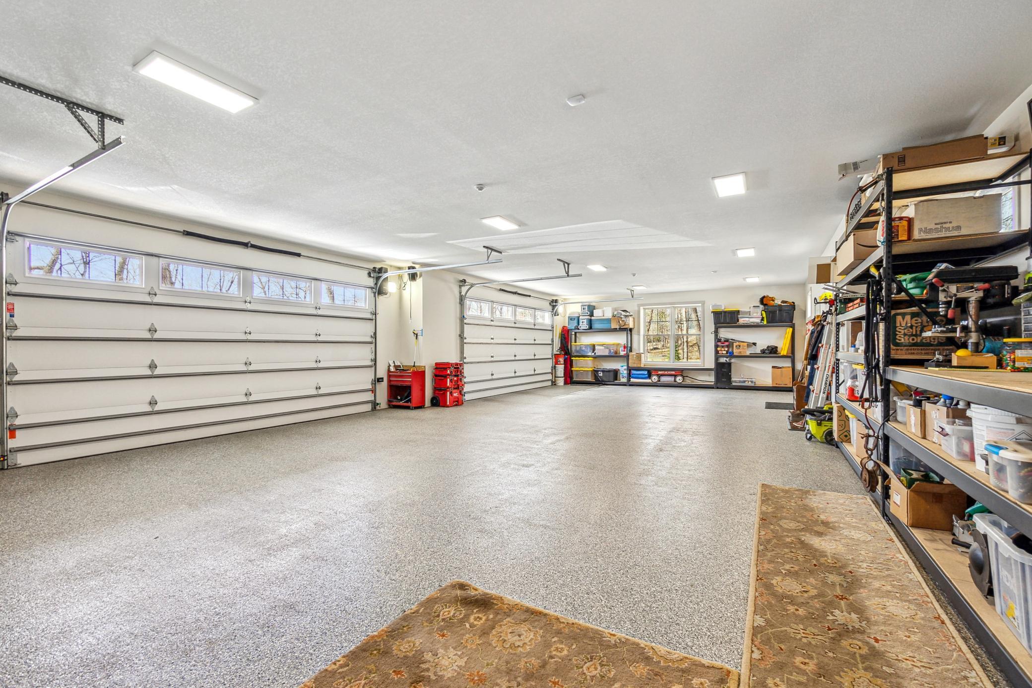 Four car attached garage with in floor heat and workshop area.
