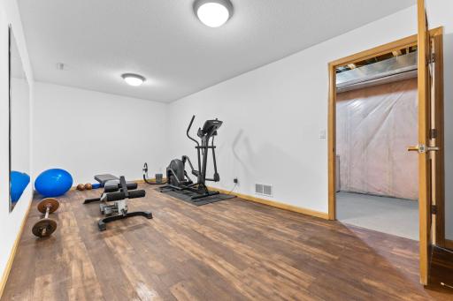 Bonus space perfect for an exercise room, game room and more! The elliptical machine can stay with the home if desired.