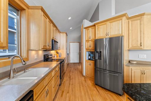 Tons of cabinets, huge pantry, built in computer desk, and a locker style drop station for your coats and shoes.