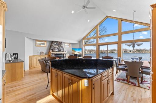 Huge center island with lots of storage and a beautiful sparkling granite countertop.