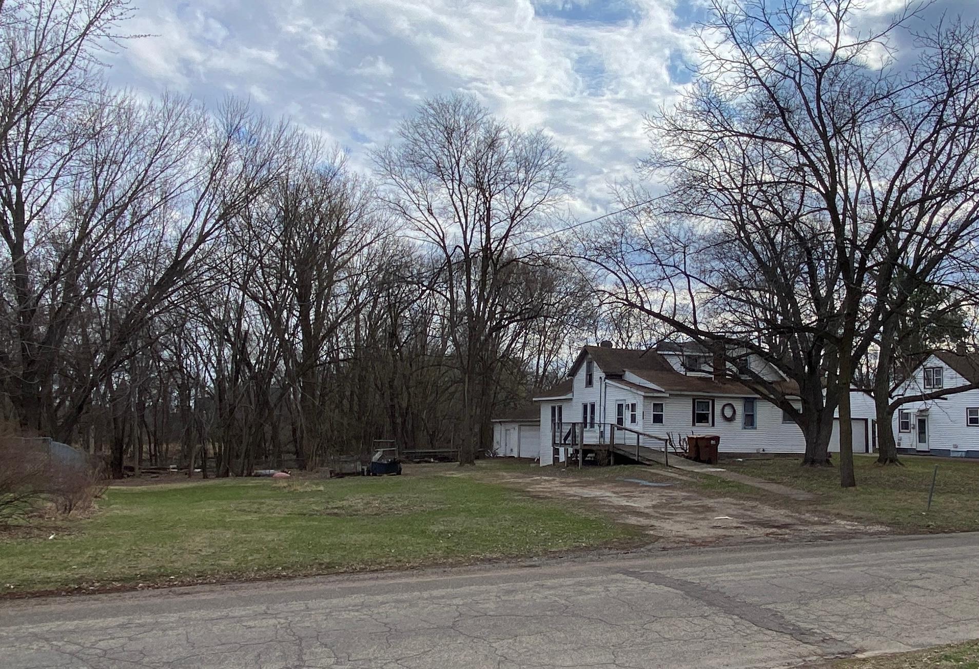 The adjacent vacant lot is also available to buyers.