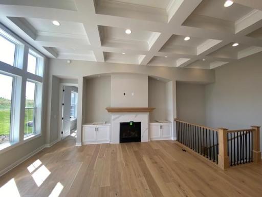 7416 inverness gathering room and coffered ceiling. This home is under construction & almost complete! 4 bedrooms! Finished lower level with wet bar! Oversized 2-car garage