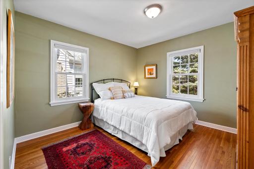 1 of 2 main floor bedroom with gorgeous original hardwood floors.
