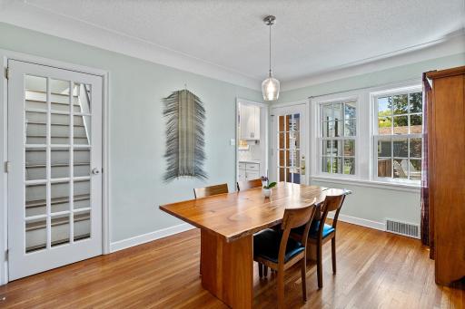 Spacious dining area overlooking backyard.