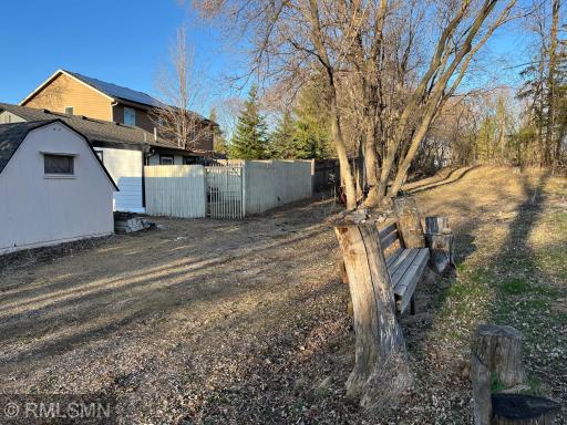 View on side of lot with built in bench and driveway