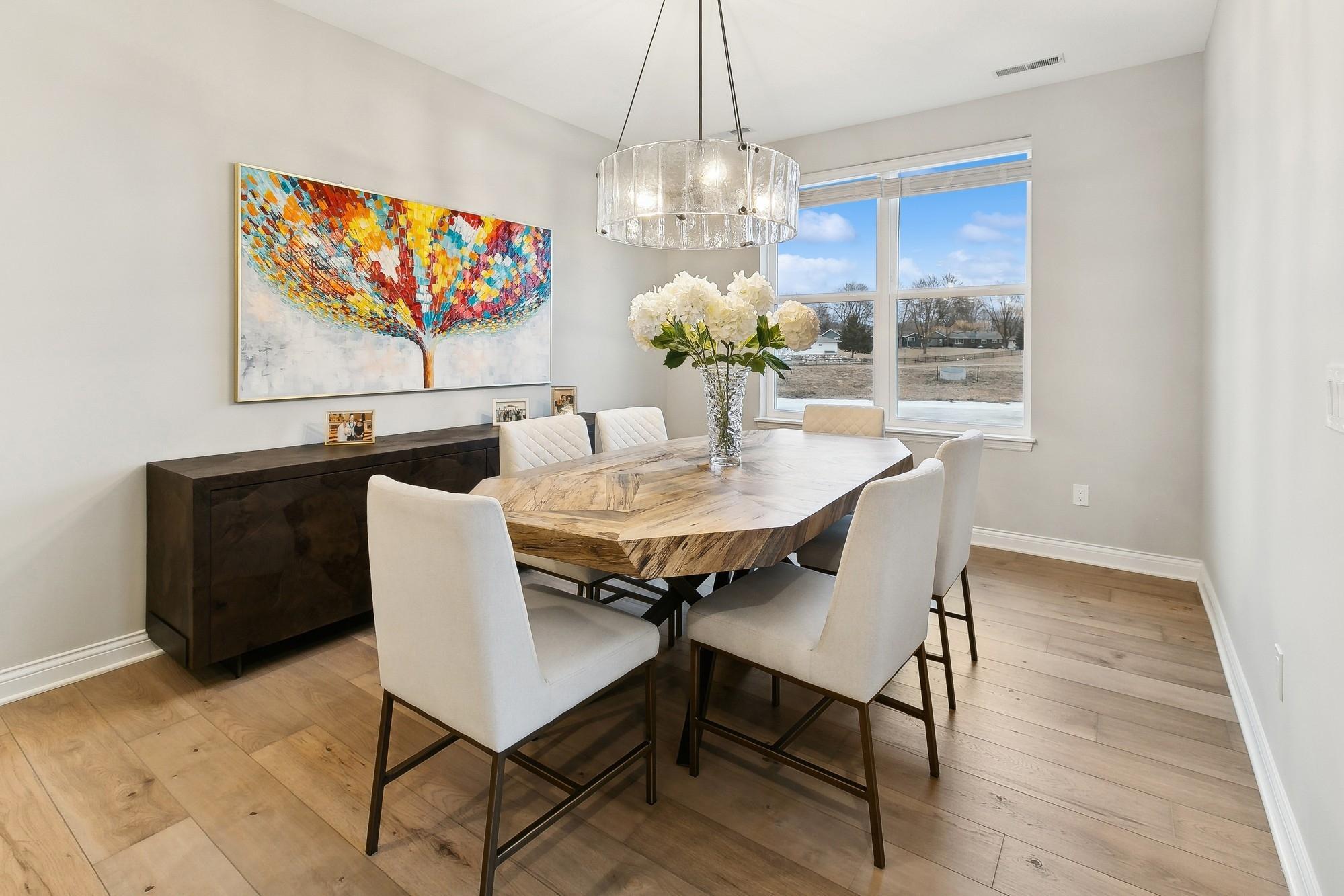 Lovely and spacious dining area with plenty of natural lighting to shine through.