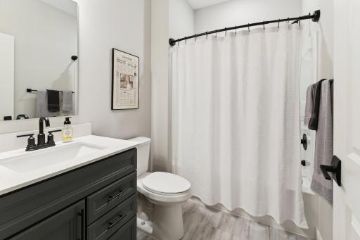 Full bath that comes off the foyer and is adjacent to the second bedroom. Perfect for everyday + overnight guests.