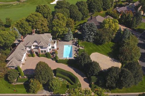 Prestigious Olympic Hills Community. Striking presence and curb appeal. Note - photo taken last summer before extensive work was completed. New roof with Presidential grade shingles.