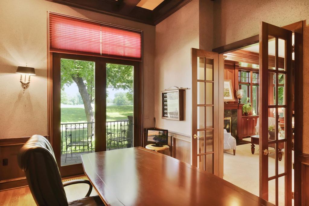 Main level office is fit for an executive! Coffered ceiling and access to your private balcony with views of the Olympic Hills Golf Course.