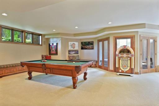 The lower level is ready for your entertaining with game area, billiards room, wet bar, hot tub & sauna.