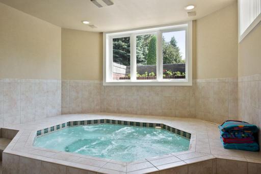 Indoor hot tub in the lower level