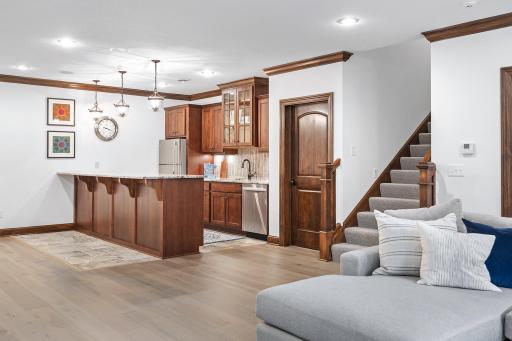 Lower level wet bar is a great entertaining space