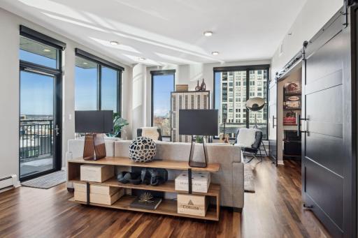 The other end of the wide open layout showcases another living space