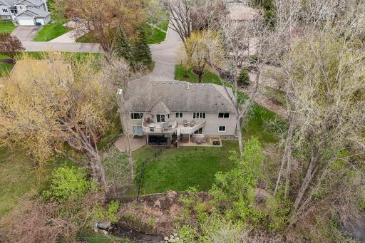 Nestled on a generous lot under mature trees, it has an 'Up North' feel