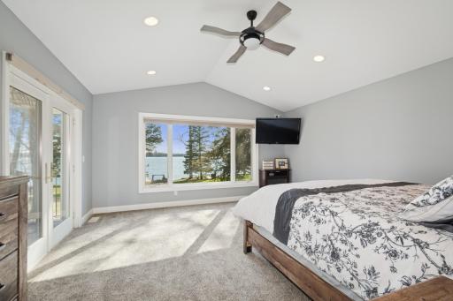 Main level primary bedroomsuite with amazing lake views!