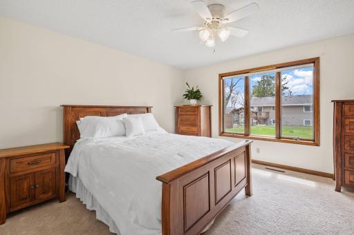 Main floor primary bedroom with private walk in closet and bathroom.