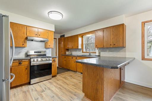 Practically laid out kitchen/dining area you will LOVE preparing meals in. Tile backsplash, dishwasher added, new appliances, updated floor, updated light fixtures, and so much more!
