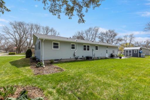 Landscaping surrounds the home on all sides