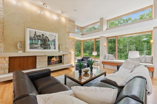 Handcrafted Venetian plaster adorns the fireplace, while Lutron lighting enhances nightly. A niche behind the art provides bracketing & connections for your flat screen if you are so inclined.
