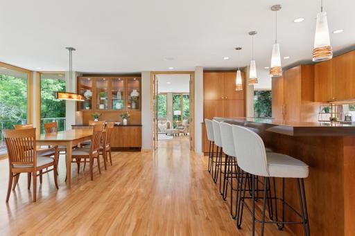 Floor plan with flow! Beyond table & bar height dining open French doors to a family room & beyond it an open air deck. Another deck access is to the left just beyond camera view. Pivot 180 for the great room with clerestory.