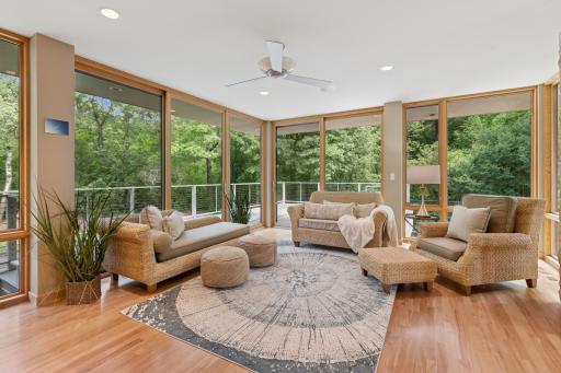 Tranquility! Brilliant design gives you a family gathering room & nature provides the drapes. If the mood moves you, a pair of doors grant access to a huge deck. The restorative effects of nature are well studied, you should test that theory here!