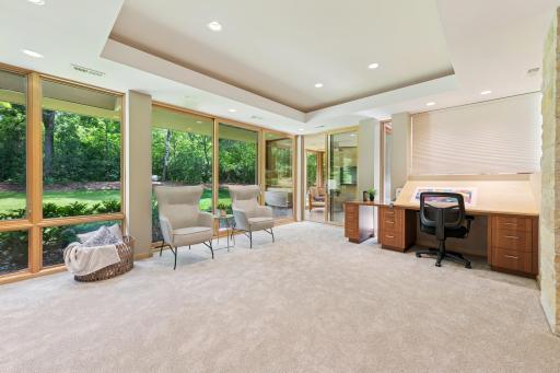 Currently seen as a fantastic artist studio, this is an excellent creative space. Nicely suited to various activities. Huge walk-in closet, plus a wall of custom cabinets are here, but out of camera view. If you desire a 3rd office it's here for you.