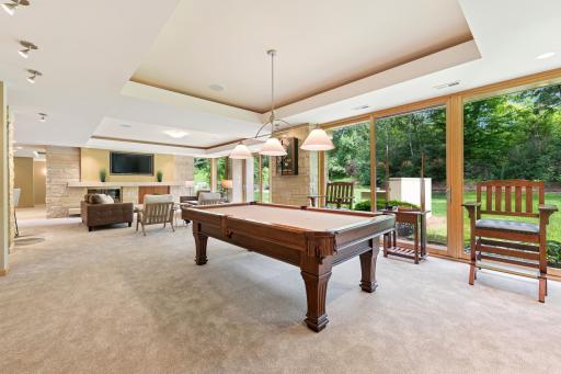 New carpet, flowing spaces. Another walkout access to the big backyard. Yes, Lutron lighting controls include the ceiling recess & more. Off camera left, there is a huge walk-in closet, great bonus storage with easy access.