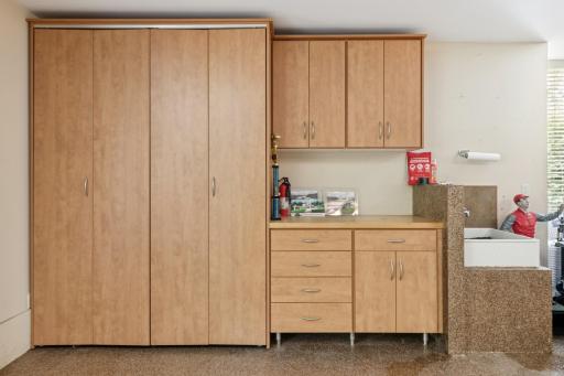 Bonus storage, hobby counter & a sink with hot & cold water. Wash up without going inside of your home. If you garden or cycle or explore on foot, sometimes a quick rinse or washing an kerchief is just what you need & its here in the garage too.