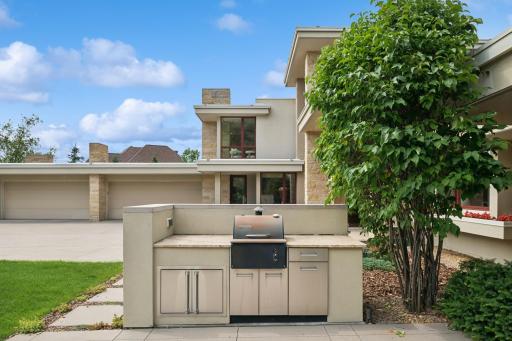1st of two outdoor kitchen spaces! Plus, there is plenty of patio space for a table & chairs. The breakfast room gives you easy access to this front patio & the main kitchen is nearby for convenience.