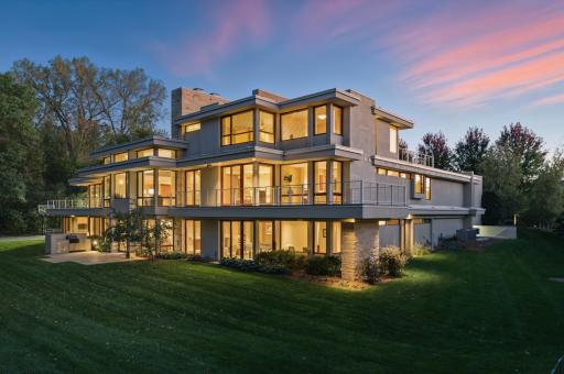 Acreage woodland setting in harmony with a wealth of windows combine to lovely effects both inside & out! The brilliance of great design by Architect Charles Stinson is apparent in every sight line & illuminations by night or by day. Splendid indeed!