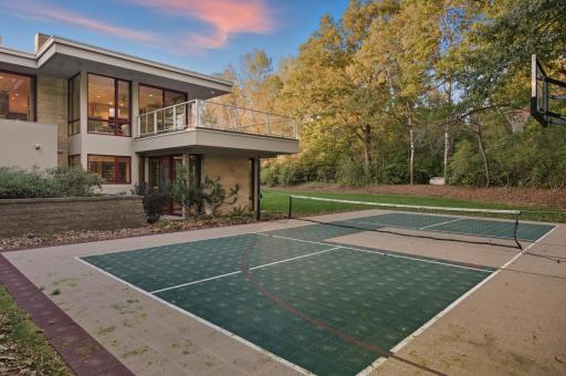 This private sport court with evening lights for extended play awaits for your enjoyment. Games start & end on your schedule, (reservations unnecessary). See other images of the 4 season porch, open air decks & huge level backyard.