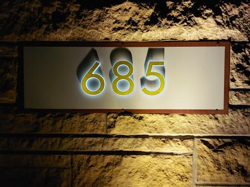 This address marquee announces to your guests that they have arrived. A theme of hand-chiseled stone begins here & continues to the exterior elevations & to the interior accents.