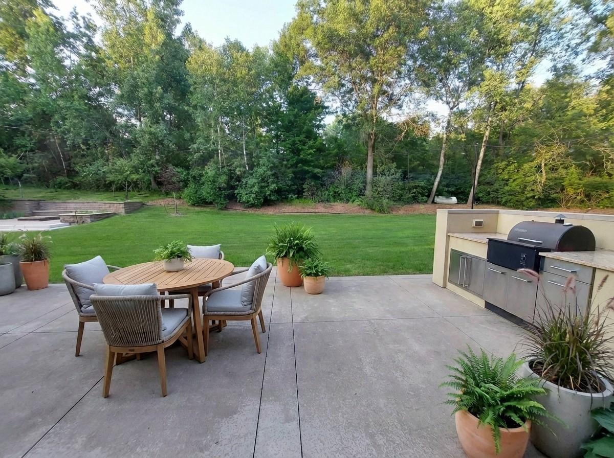 2nd patio & 2nd kitchen with space for another table setting off camera left. Huge playful yard & your fire pit is across the lawn. Ample trees & privacy are at home in this acreage setting. Virtual staged.